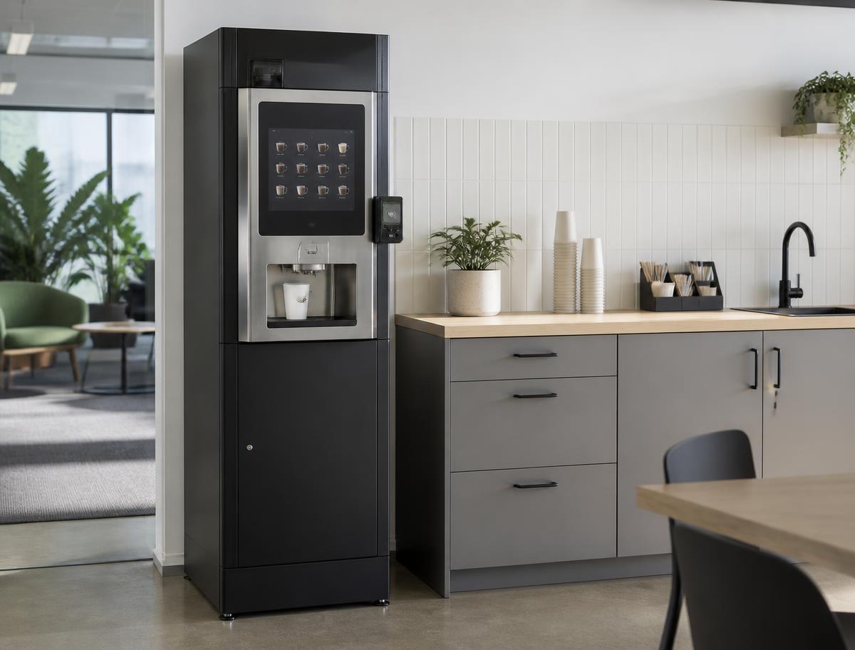 Automatic bean-to-cup coffee vending machine with contactless payment in an office kitchen